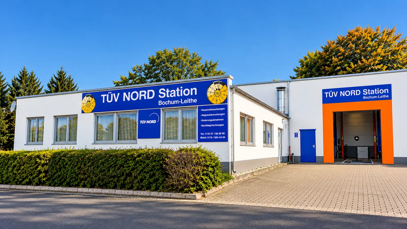 Außenansicht der TÜV NORD Station Bochum-Leithe mit Bürogebäude und Prüfhalle